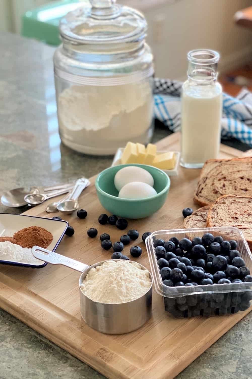 eggs, flour, blueberries, milk, butter for blueberry pancake recipe