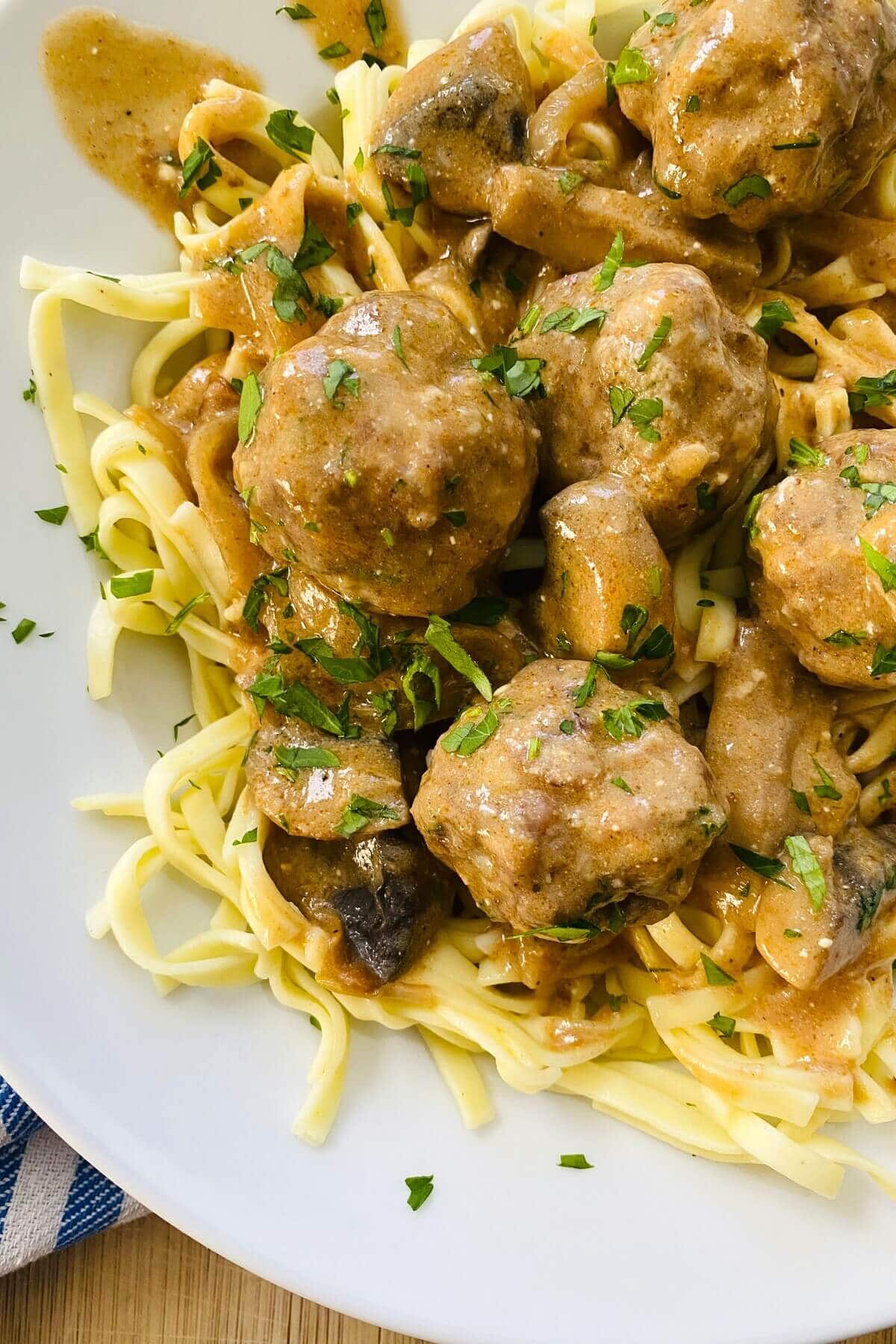 Stroganoff meatballs served over noodles.