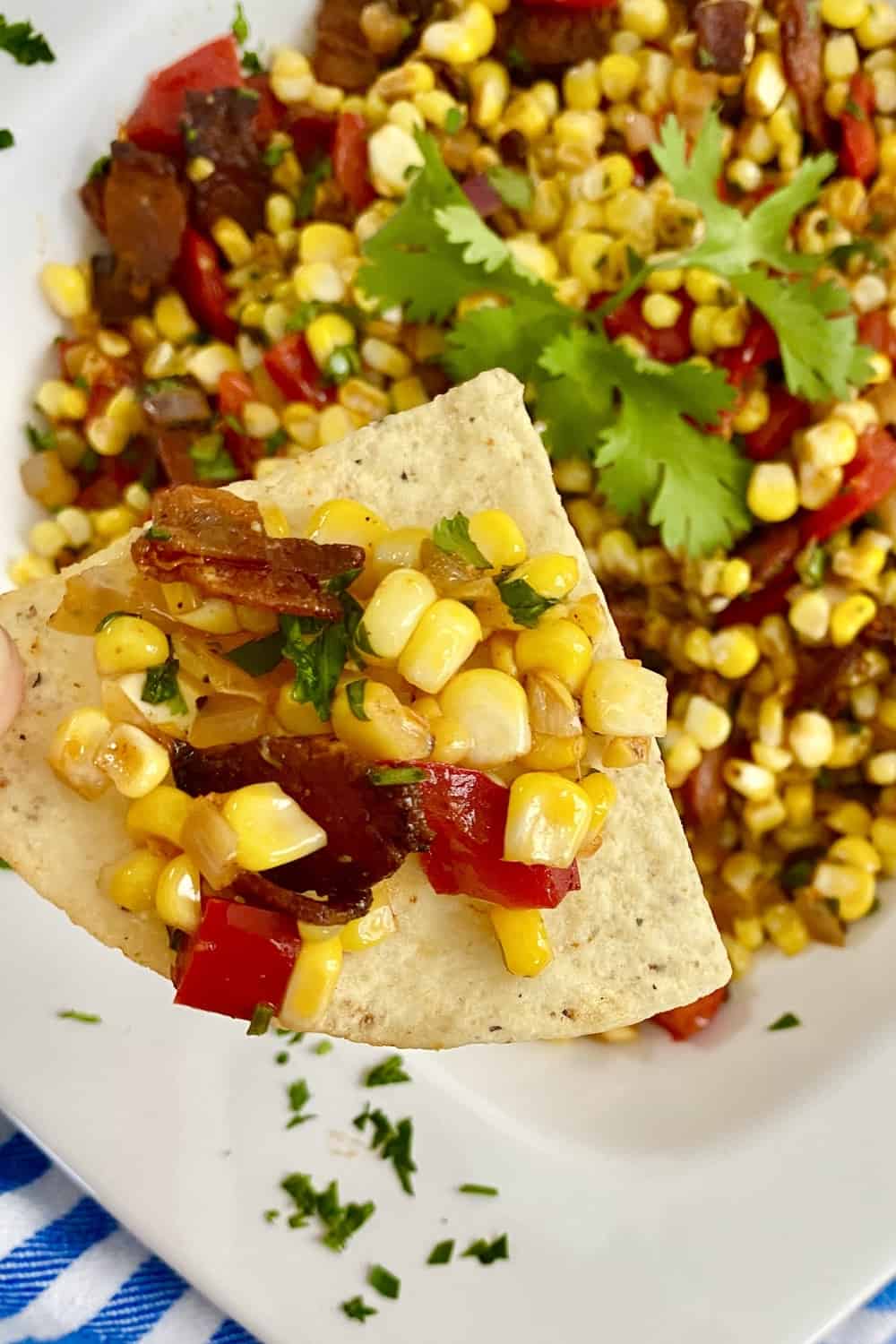 sweet corn salad on a tortilla chip