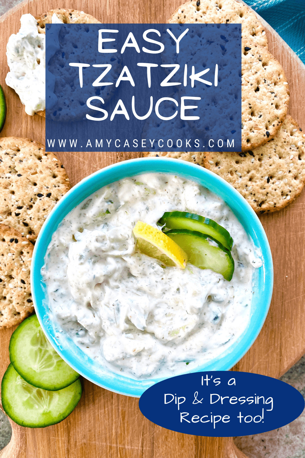 dish of tzatziki sauce with crackers and cucumbers