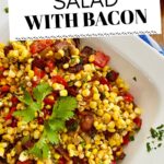 Large bowl of corn salad with bacon and herbs.