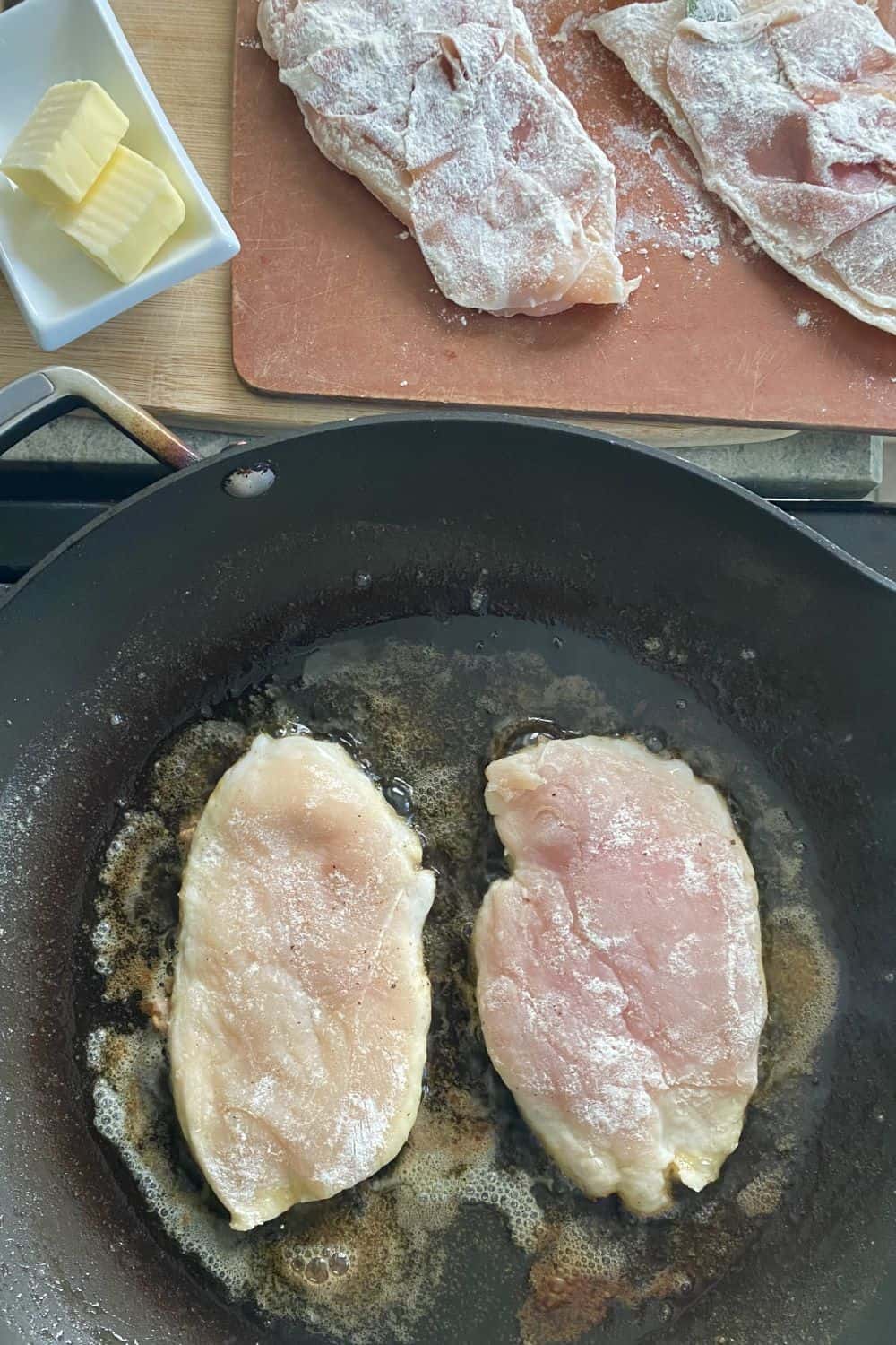 cooking chicken in a pan.
