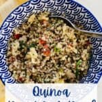 A bowl with a quinoa, scrambled eggs and spinach.