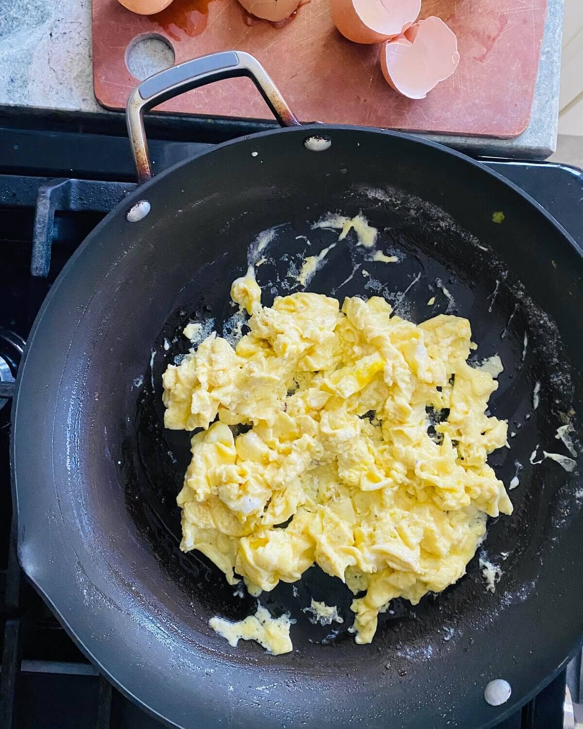 Scrambled eggs in a pan.