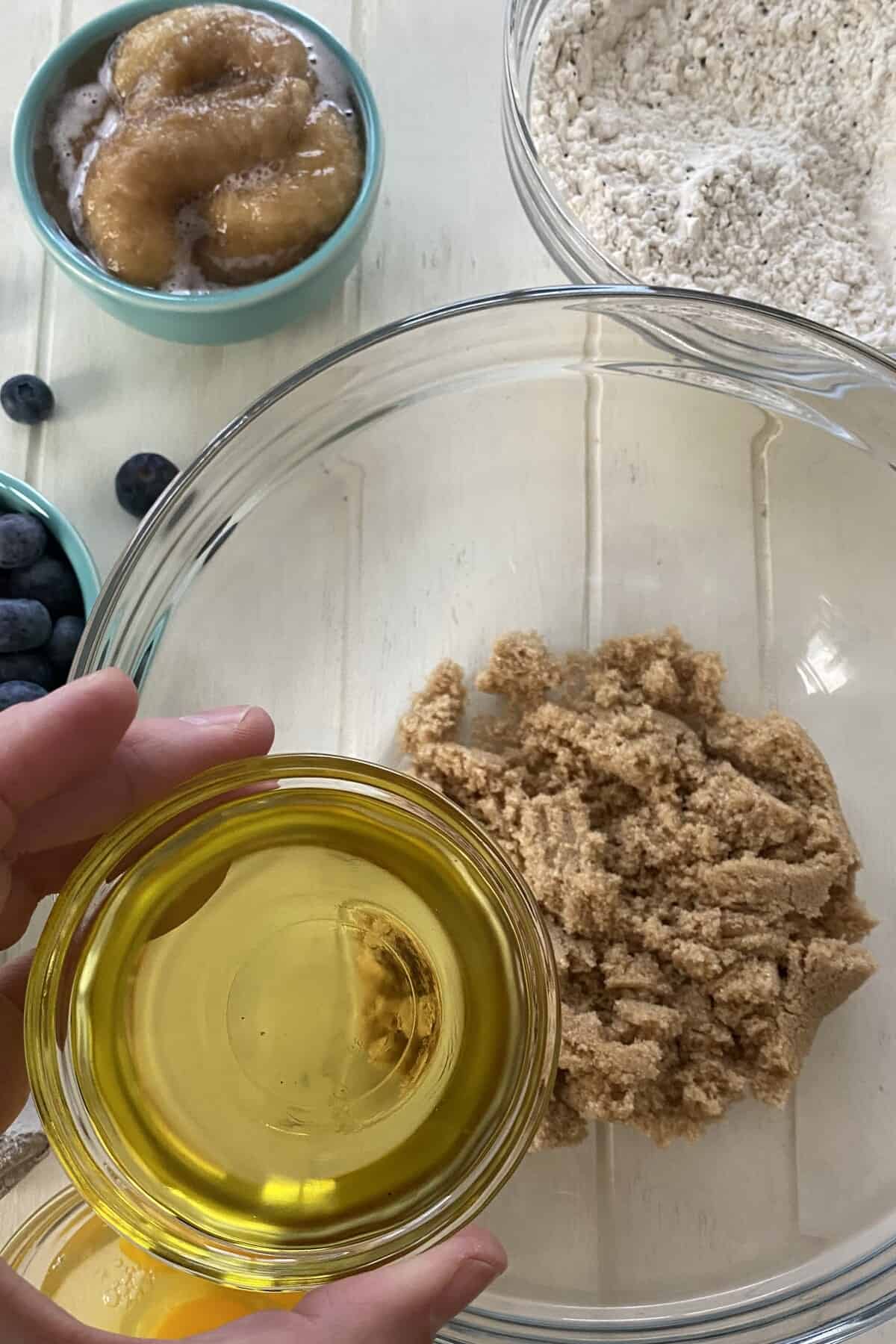 Adding olive oil to light brown sugar.