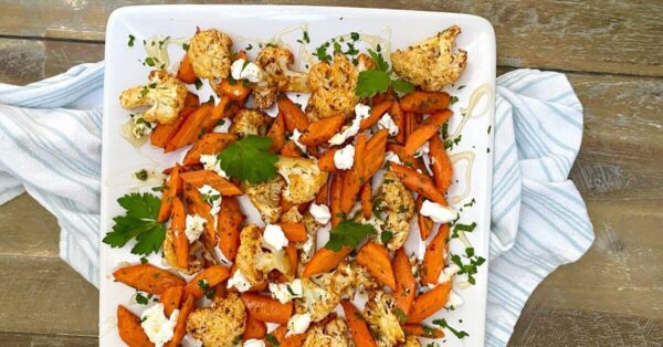 a platter of roasted carrots and cauliflower.