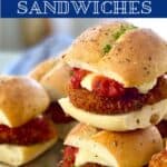 mini chicken parm sandwiches stack on top of each other.