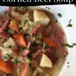 hearty bowl of soup with cabbage, potatoes, carrots and cabbage.