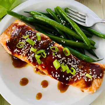 plated teriyaki salmon with green beans.