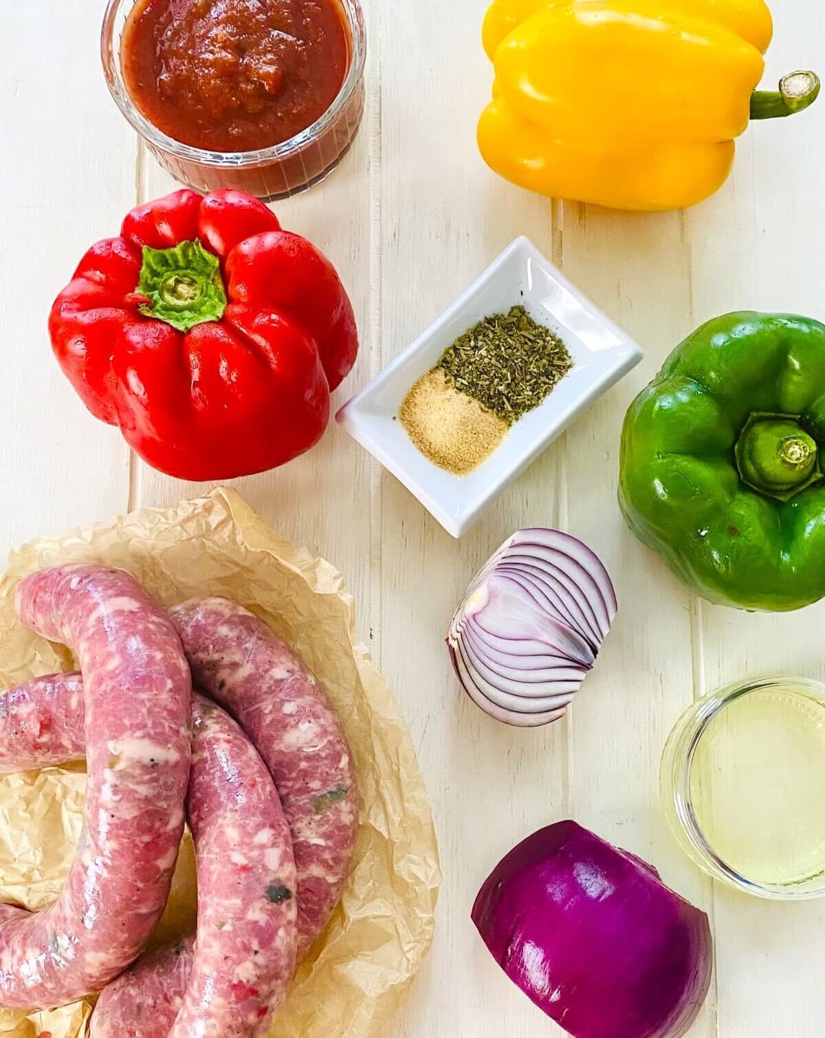 Italian sausage, bell peppers, red onion, marinara sauce, olive oil.