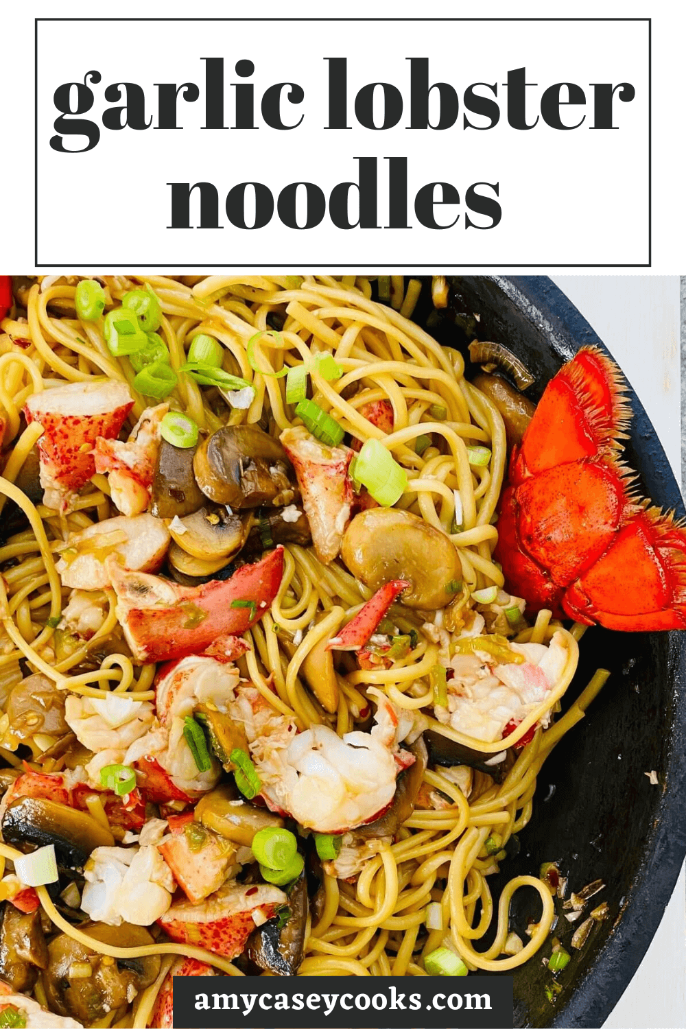 lobster noodles with mushrooms in a sauté pan.