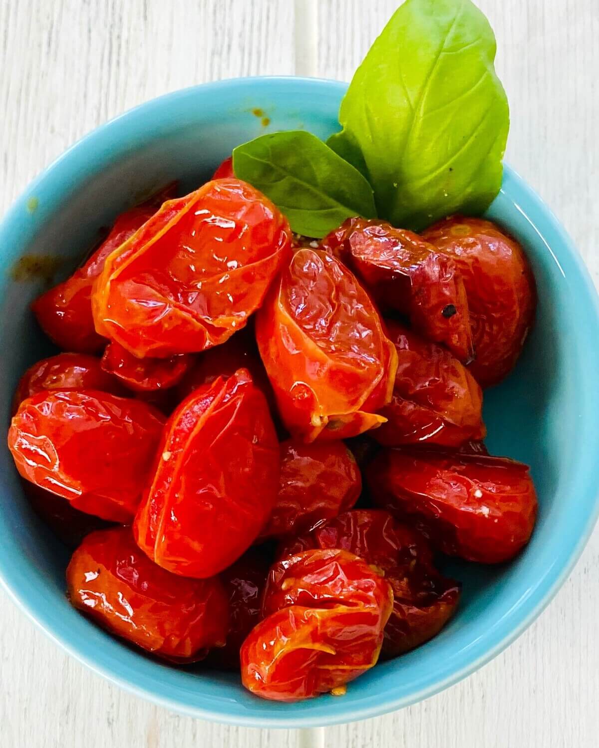 oven roasted cherry tomato sauce in a bowl.