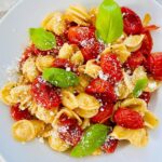 Chunky roasted cherry tomato sauce over pasta.