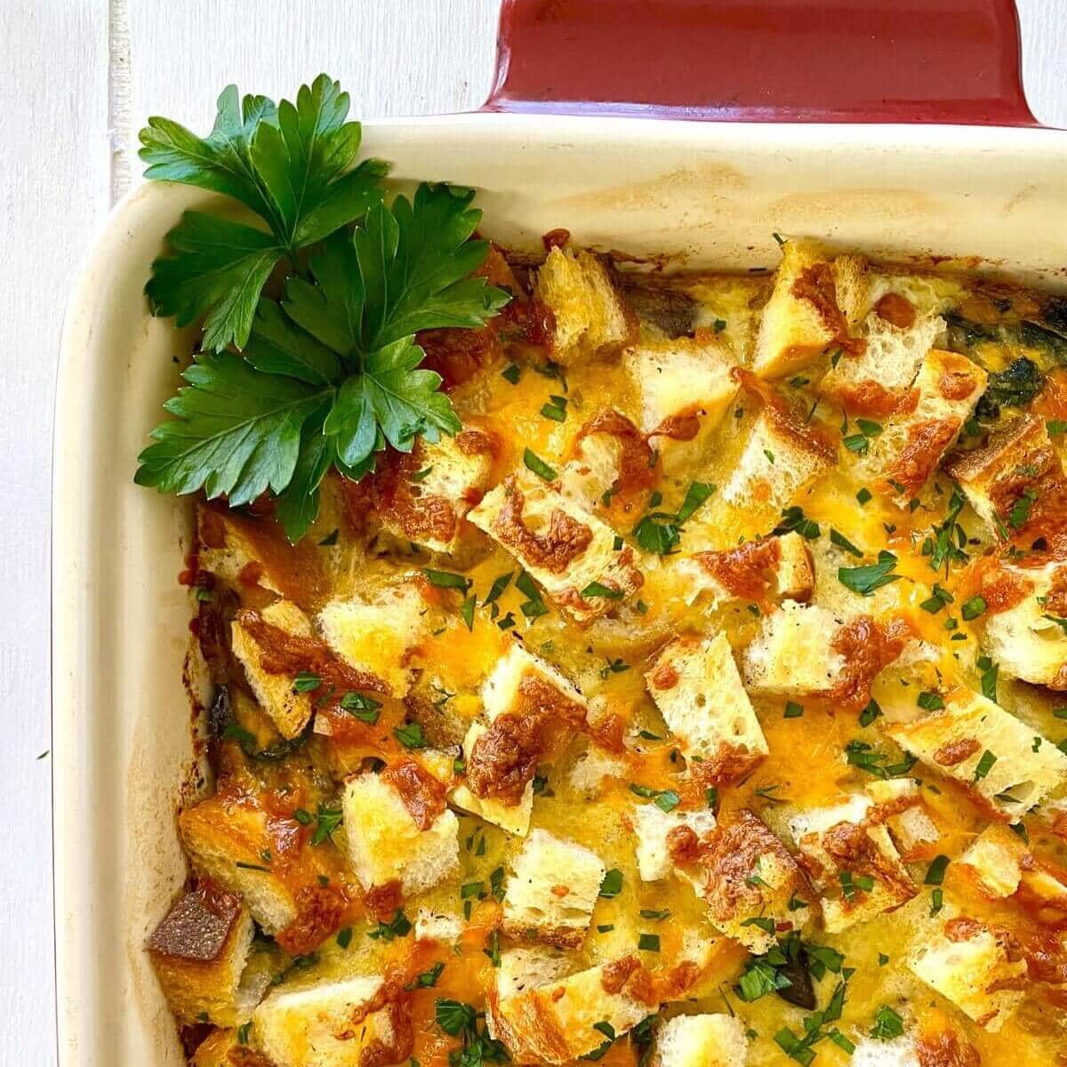 egg casserole with croutons, sausage and mushrooms.
