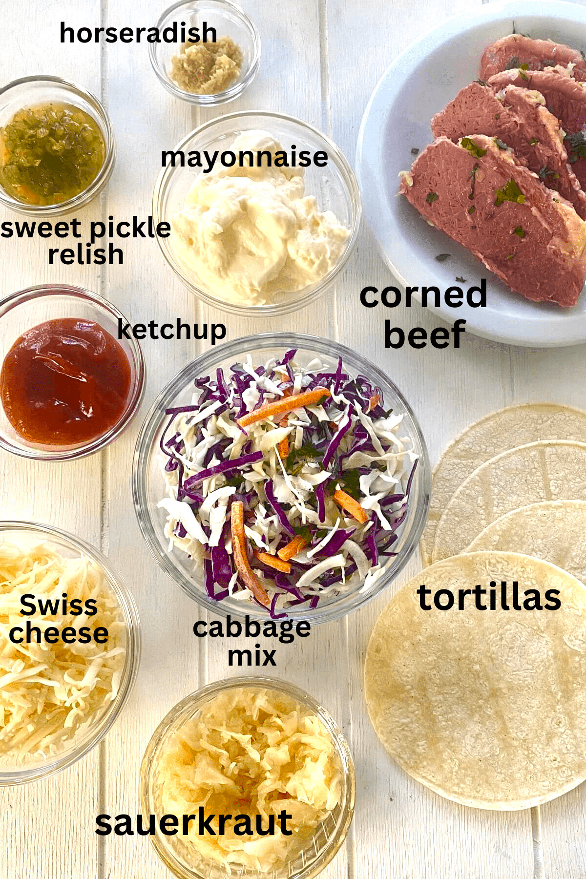 cooked corned beef, corn tortillas, mayo, cabbage, Swiss cheese, sweet pickle relish, horseradish.