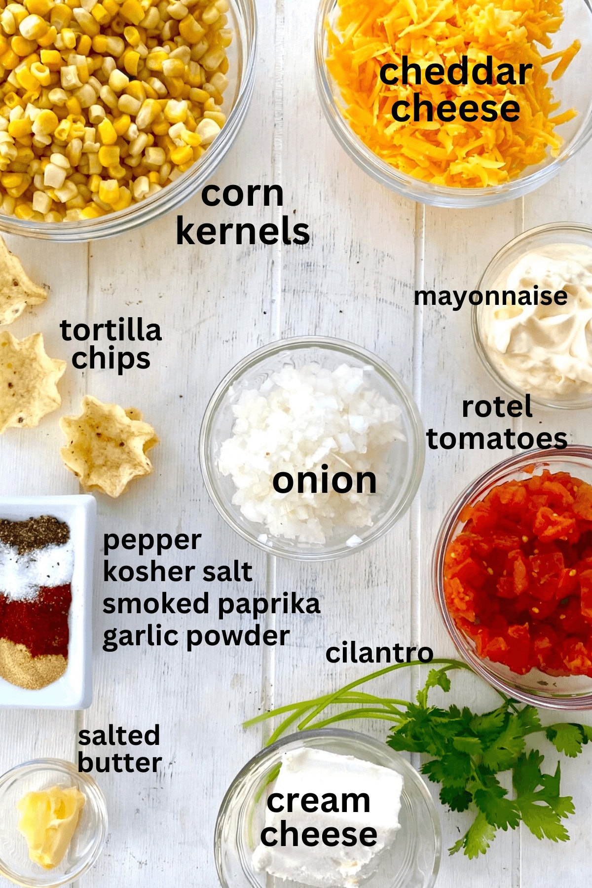 corn, cheese, onion, mayo, spices, cilantro, tomatoes.
