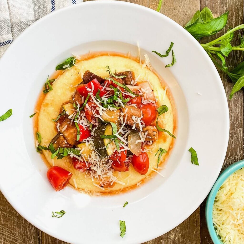 Crock pot ratatouille over polenta with fresh basil.