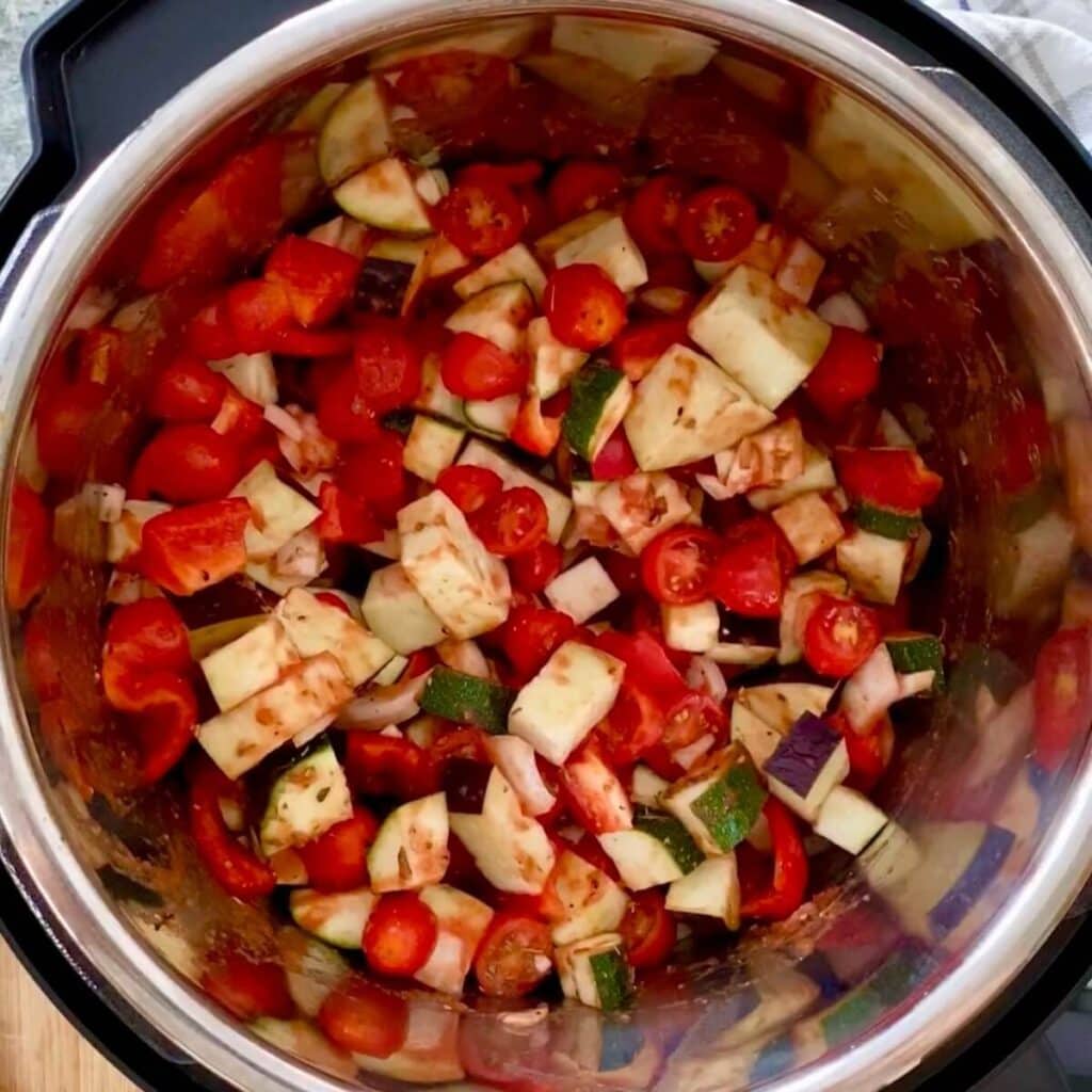 Diced vegetables in an Instant Pot crock pot.