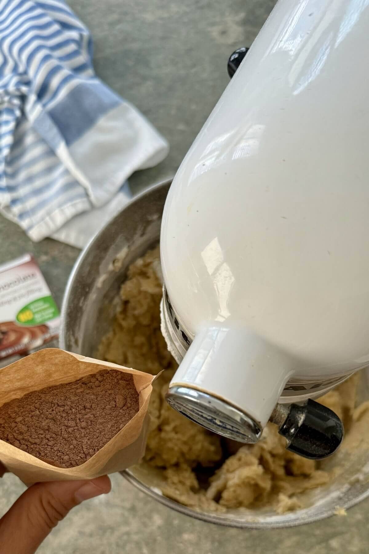 Adding instant pudding mix to cookie batter.