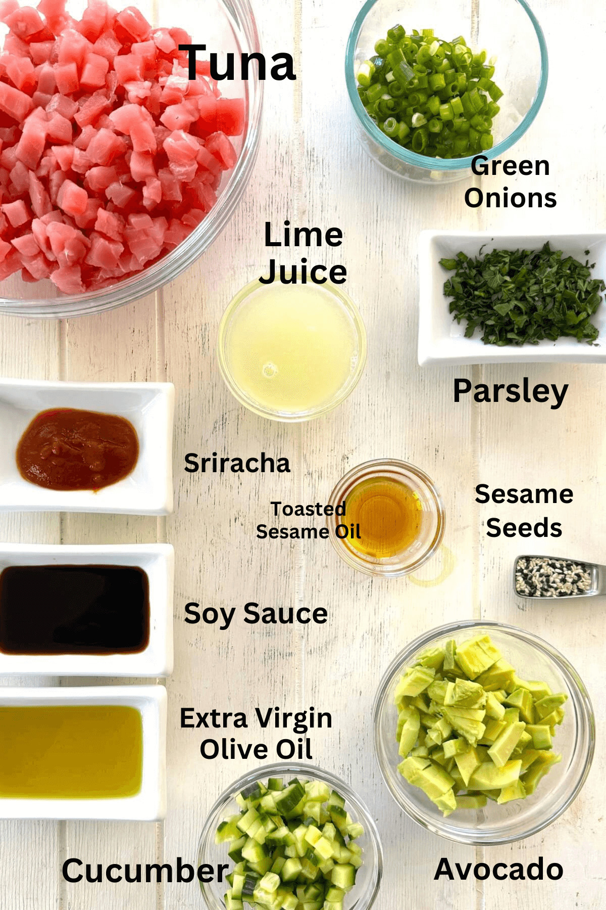 A display of raw tuna, lime juice, avocado, cucumber, soy sauce.