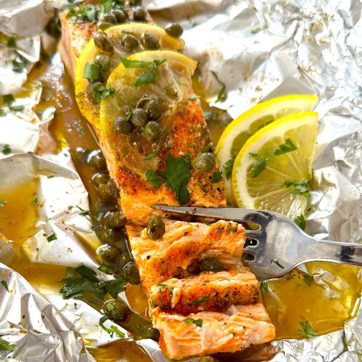 A salmon fillet baked in a foil packet.