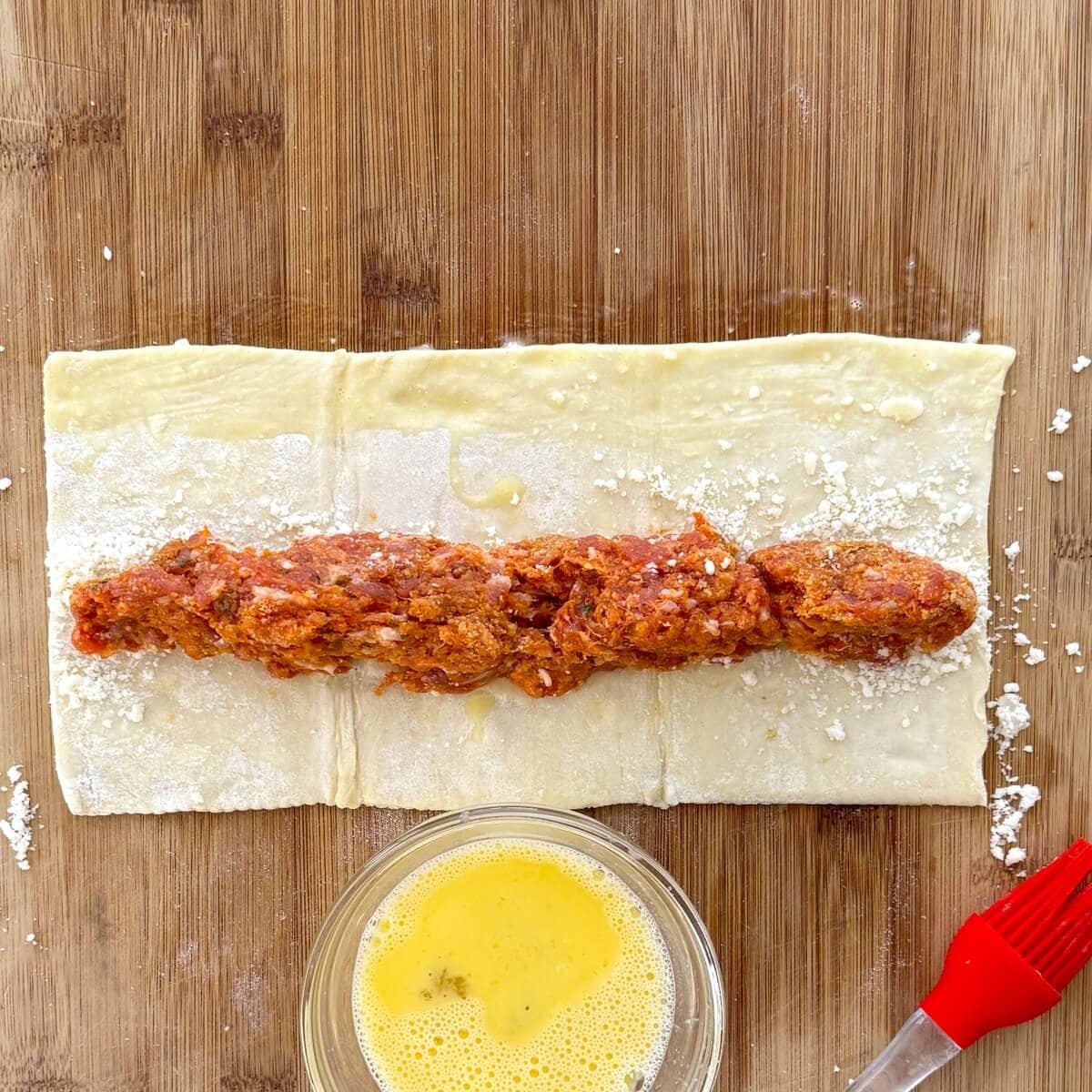 Puff pastry with Italian sausage on it.