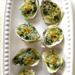 Baked and plated oysters Rockefeller.