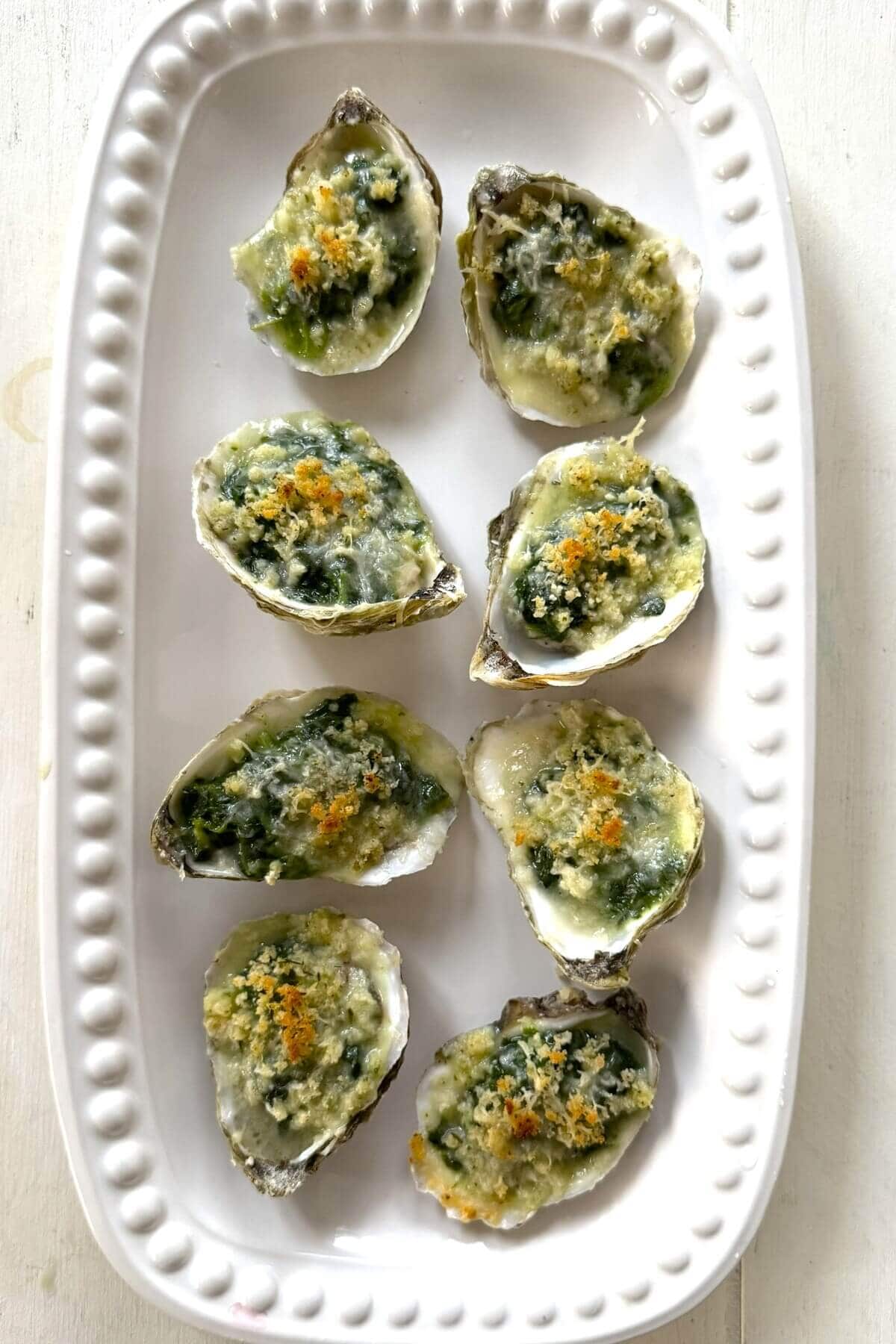 A plate of oysters Rockefeller for serving.