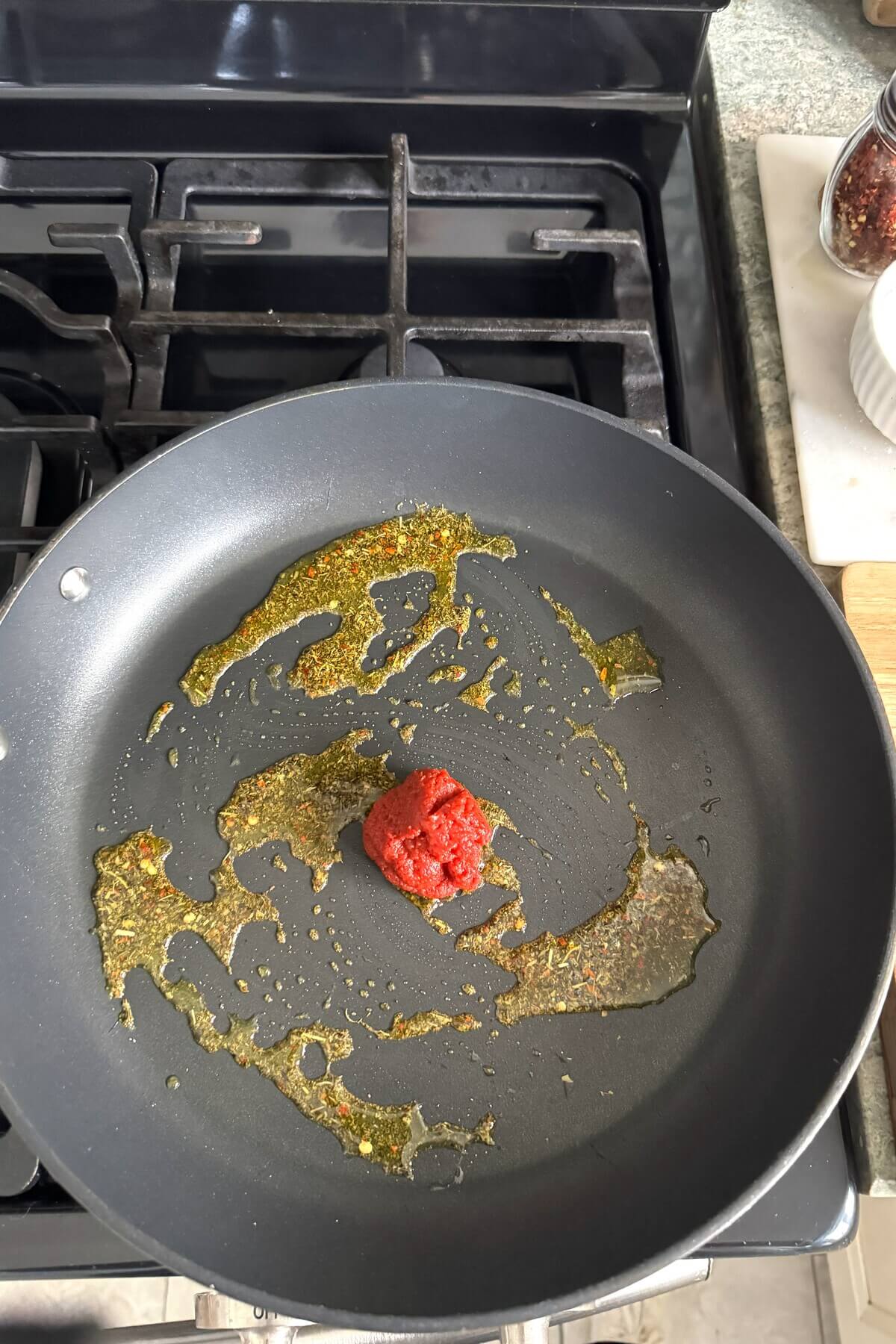 Tomato paste in a skillet.